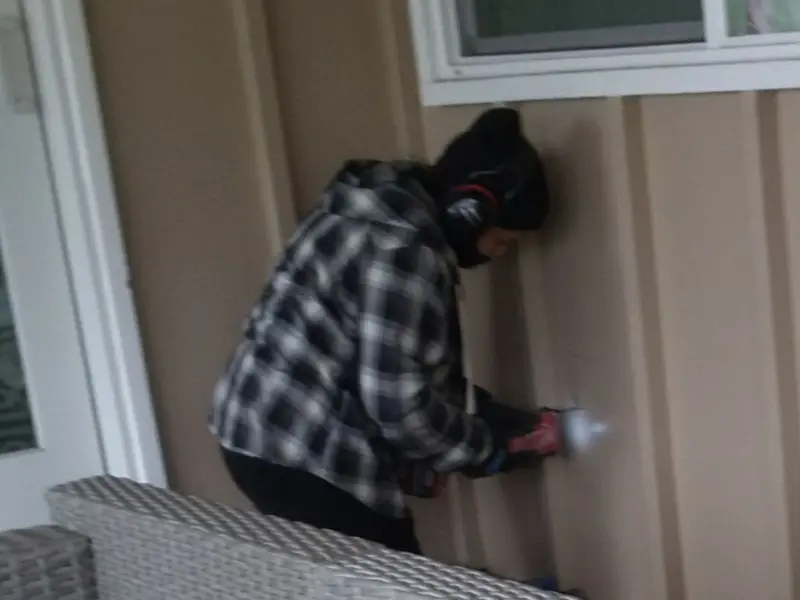 Professional electrician installing an exterior outlet in Westfield